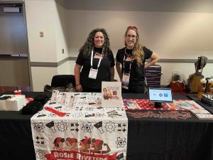 Erica Carroll (L) and Jennifer Goodyer supporting Rosie Riveters at the InfoComm 2022 Women's Breakfast.