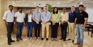 AVI-SPL local and global teams—including Mala Prasad (fourth from right)—in the new Hyderabad office after the ribbon cutting ceremony.